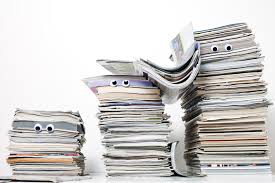 Image result for person piles of papers